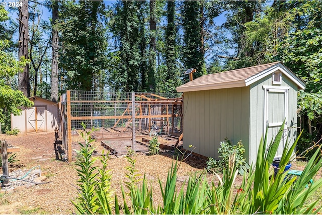 view of shed with fence