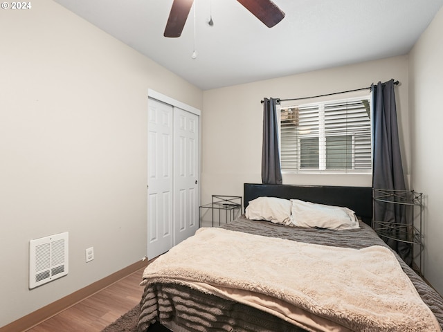 bedroom featuring a closet, ceiling fan, and wood-type flooring