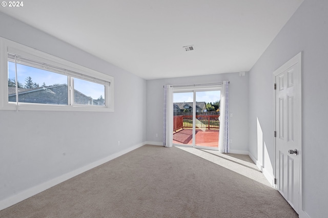 spare room featuring carpet floors