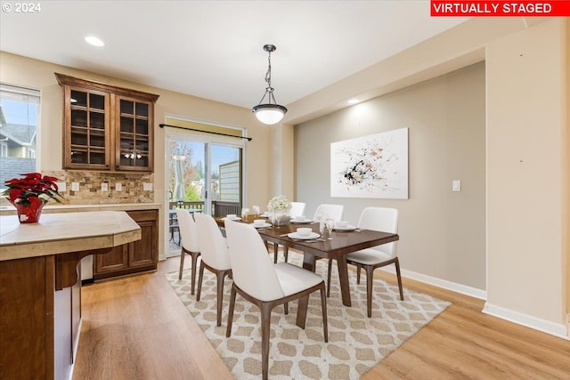 dining space featuring light hardwood / wood-style flooring