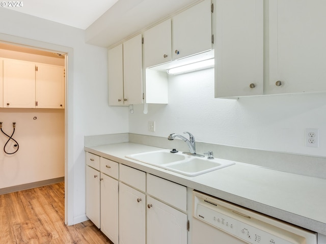 kitchen featuring dishwasher, white cabinets, light hardwood / wood-style flooring, and sink