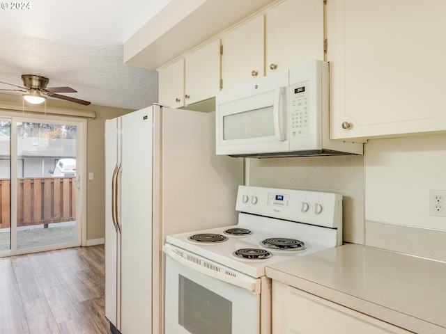 kitchen featuring ceiling fan, white cabinetry, a textured ceiling, white appliances, and light wood-type flooring