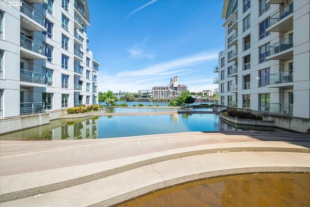 view of pool with a water view