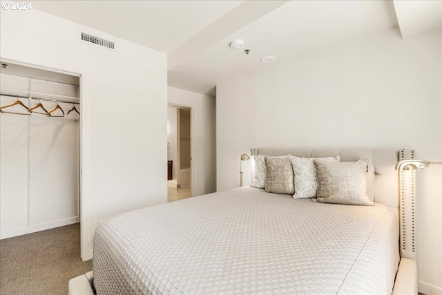 bedroom with carpet flooring and a closet