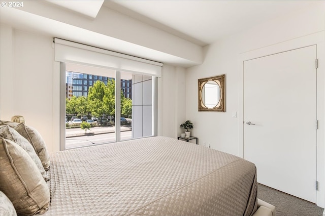 carpeted bedroom featuring access to outside