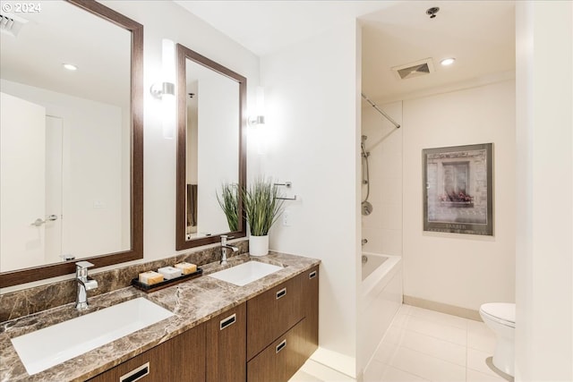 full bathroom with tile patterned floors, shower / washtub combination, vanity, and toilet