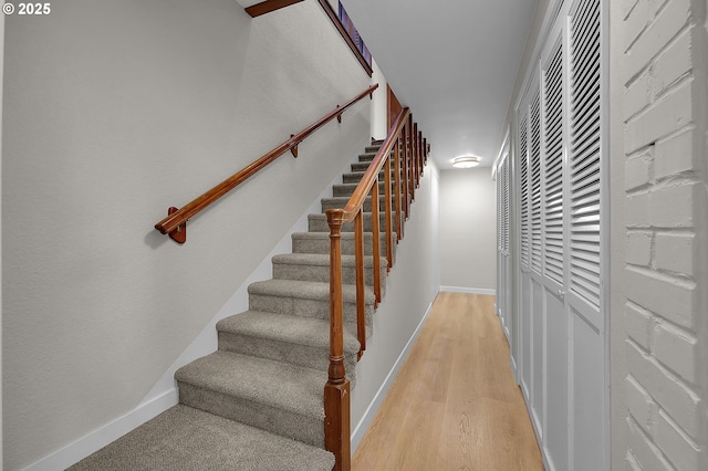 staircase featuring hardwood / wood-style flooring