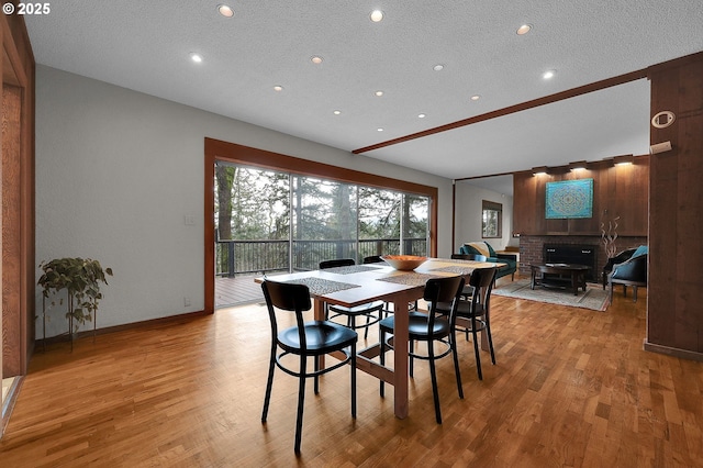 dining space featuring a textured ceiling and hardwood / wood-style flooring