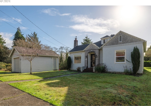 view of front of home with a front yard and a garage