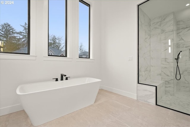 bathroom featuring separate shower and tub, tile patterned flooring, and plenty of natural light