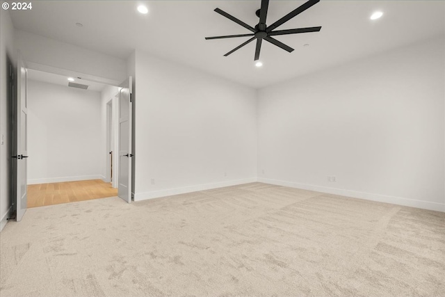 carpeted empty room with ceiling fan