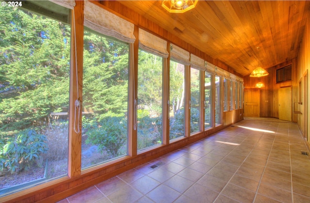 unfurnished sunroom featuring wooden ceiling