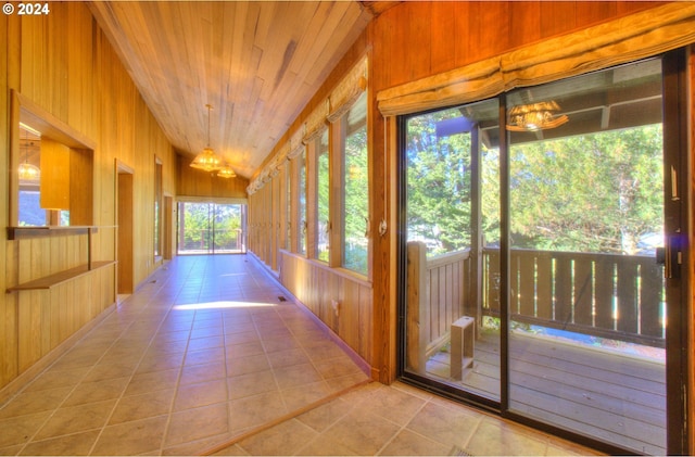 unfurnished sunroom with wooden ceiling