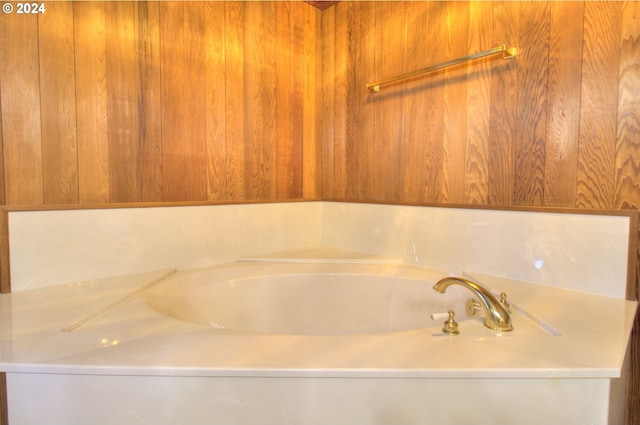 bathroom with a tub to relax in