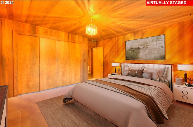 bedroom with wooden ceiling, wooden walls, and an inviting chandelier