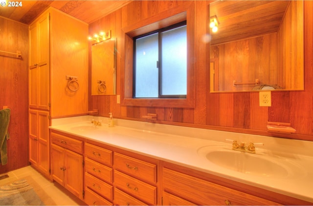 bathroom with tile patterned flooring, vanity, wooden ceiling, and wood walls