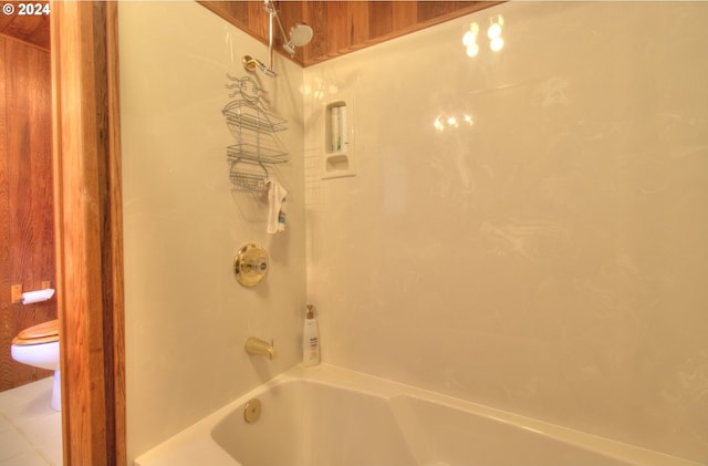 bathroom featuring toilet and shower / tub combination