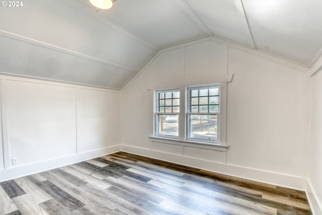 bonus room featuring hardwood / wood-style floors and vaulted ceiling