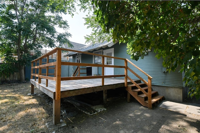 rear view of house with a wooden deck