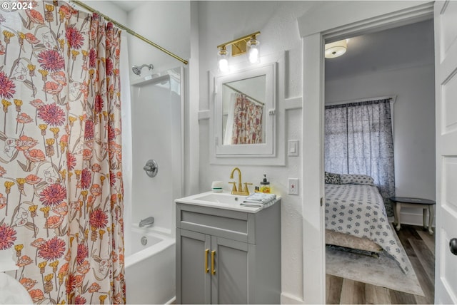 bathroom featuring vanity, wood-type flooring, and shower / bath combo with shower curtain