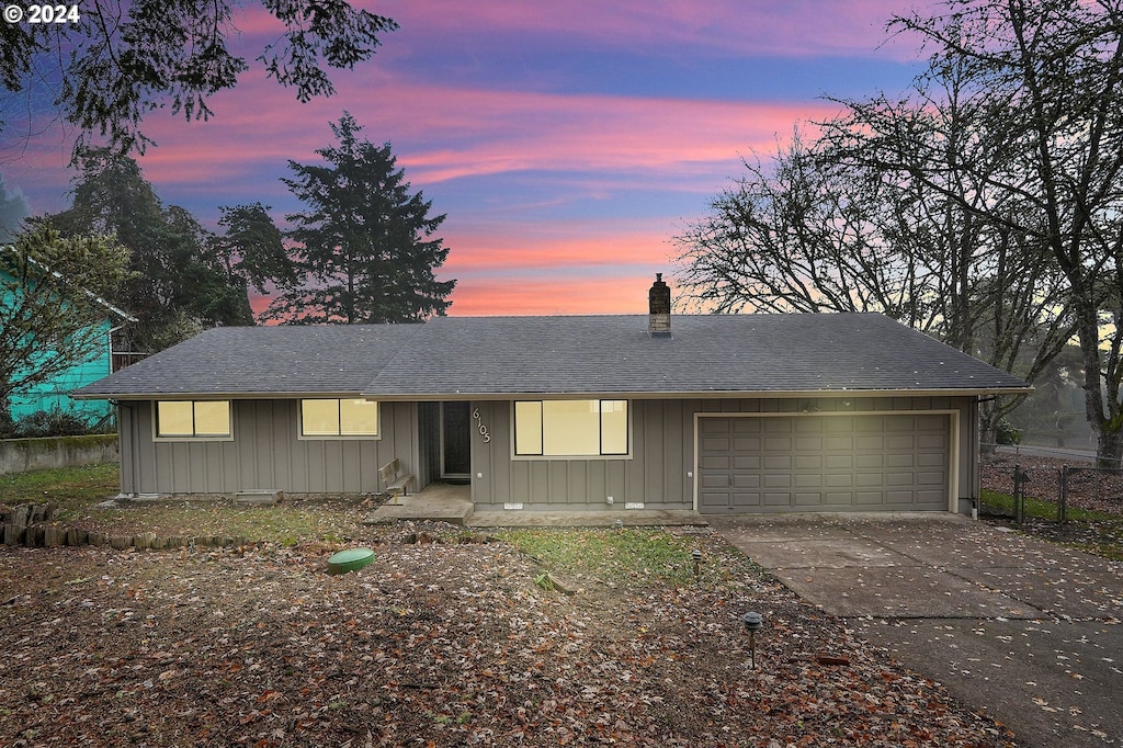 single story home featuring a garage