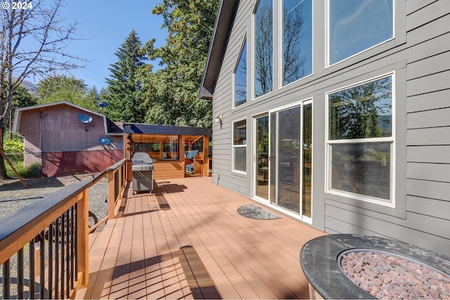 wooden terrace with area for grilling