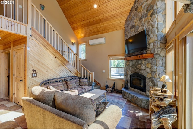 living room with a stone fireplace, a towering ceiling, wood ceiling, stairs, and a wall mounted AC