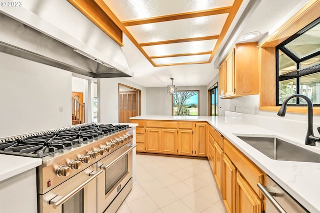 kitchen featuring exhaust hood, light tile patterned floors, sink, pendant lighting, and stainless steel appliances