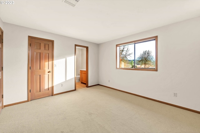 27717 Royal Ave, Eugene, OR 97402 - unfurnished bedroom featuring light carpet, baseboards, and ensuite bathroom