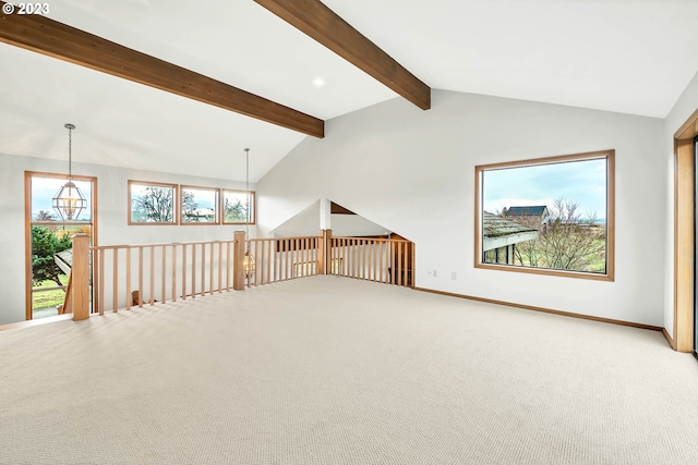 interior space featuring vaulted ceiling with beams, carpet floors, and a chandelier