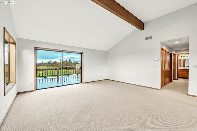 spare room with light carpet, high vaulted ceiling, and beam ceiling