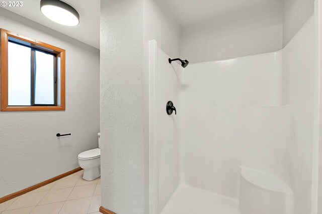 27717 Royal Ave, Eugene, OR 97402 - full bath featuring toilet, a shower, baseboards, and tile patterned floors