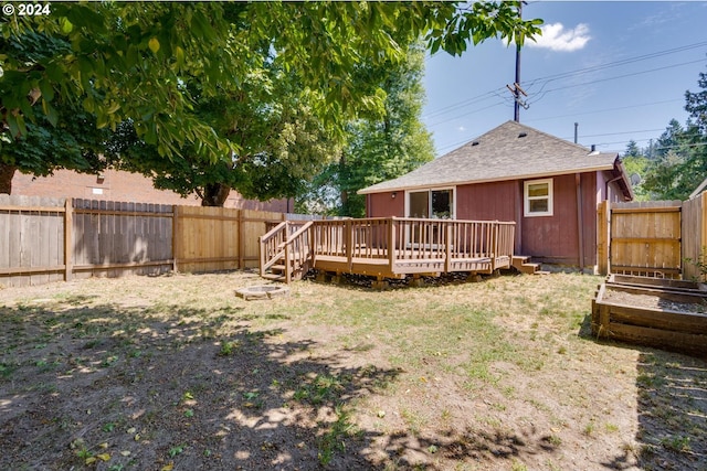 view of yard with a wooden deck