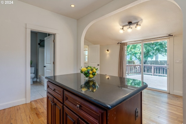 kitchen with a center island and light wood-type flooring