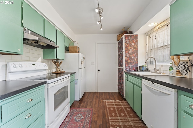 kitchen featuring white appliances, backsplash, green cabinets, sink, and dark hardwood / wood-style floors