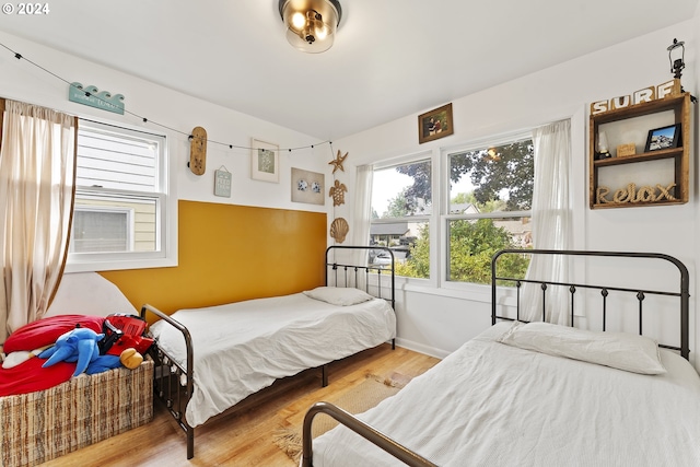 bedroom with hardwood / wood-style flooring