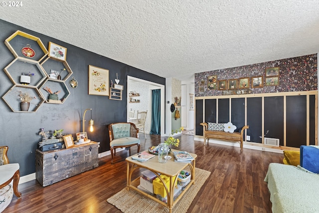 living room featuring hardwood / wood-style flooring and a textured ceiling