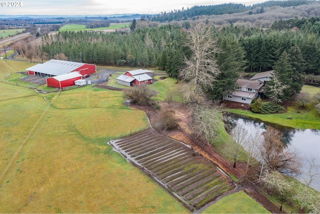 birds eye view of property featuring a rural view and a water view