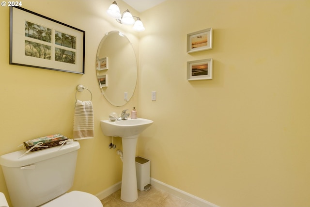 bathroom featuring tile patterned flooring and toilet