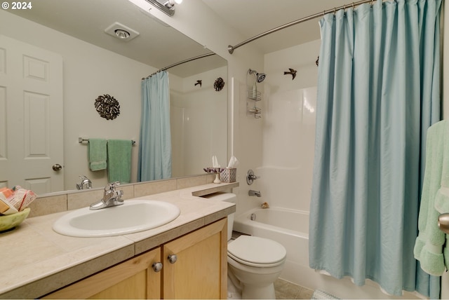 full bathroom featuring tile patterned floors, vanity, shower / tub combo, and toilet