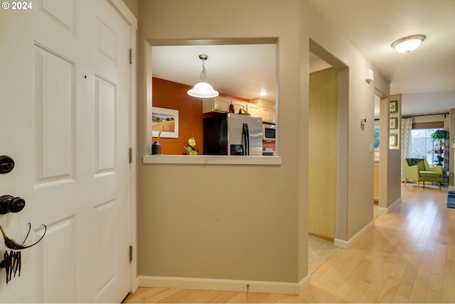 hall featuring light wood-type flooring