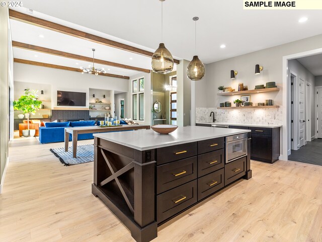 kitchen with recessed lighting, light wood-style floors, light countertops, and open shelves
