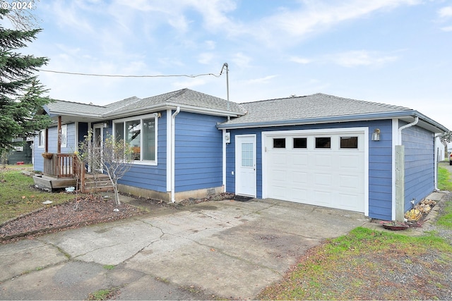 ranch-style home featuring a garage