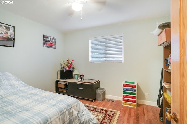 bedroom featuring ceiling fan and light hardwood / wood-style flooring