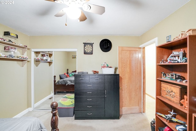 bedroom with ceiling fan and light colored carpet