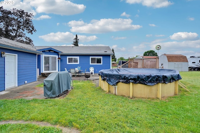 4837 Auburn Rd NE, Salem, OR 97301 - rear view of house with a yard, a patio area, and a covered pool