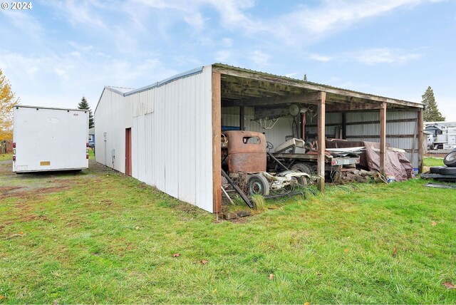 view of outdoor structure featuring a yard