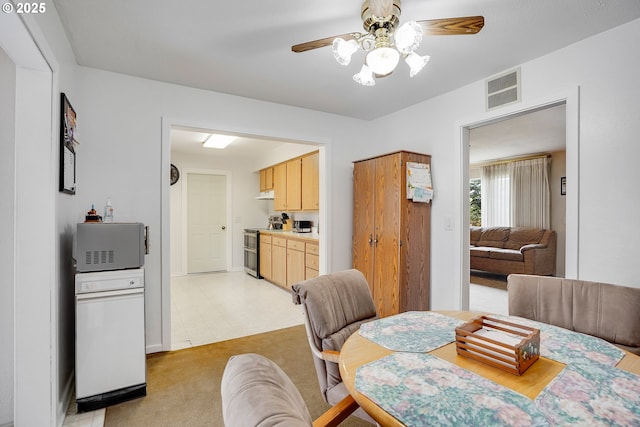 4837 Auburn Rd NE, Salem, OR 97301 - dining area with a ceiling fan, light floors, light colored carpet, and baseboards