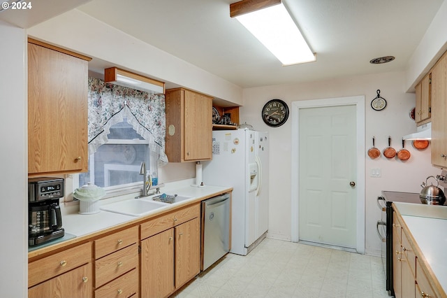 kitchen featuring light brown cabinets, stainless steel appliances, and sink