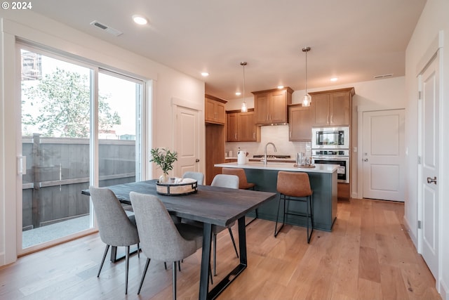 dining area with light hardwood / wood-style flooring